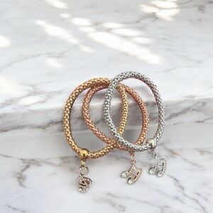 Elegant Gold and Silver Charm Bracelets